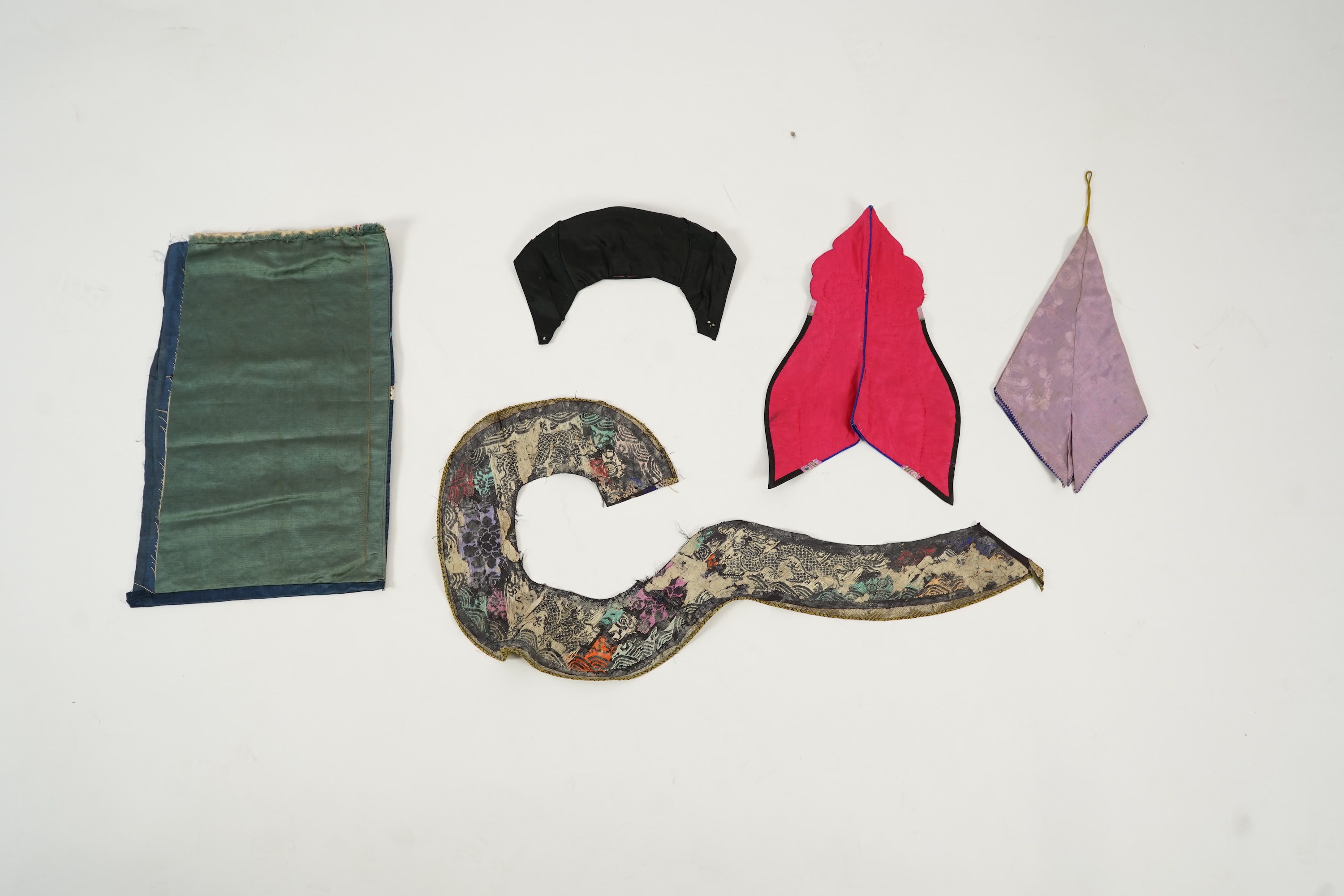 Two Chinese embroidered silk wedding skirts, late Qing, five hats, trousers, two skirt panels and two others, collar and a panel